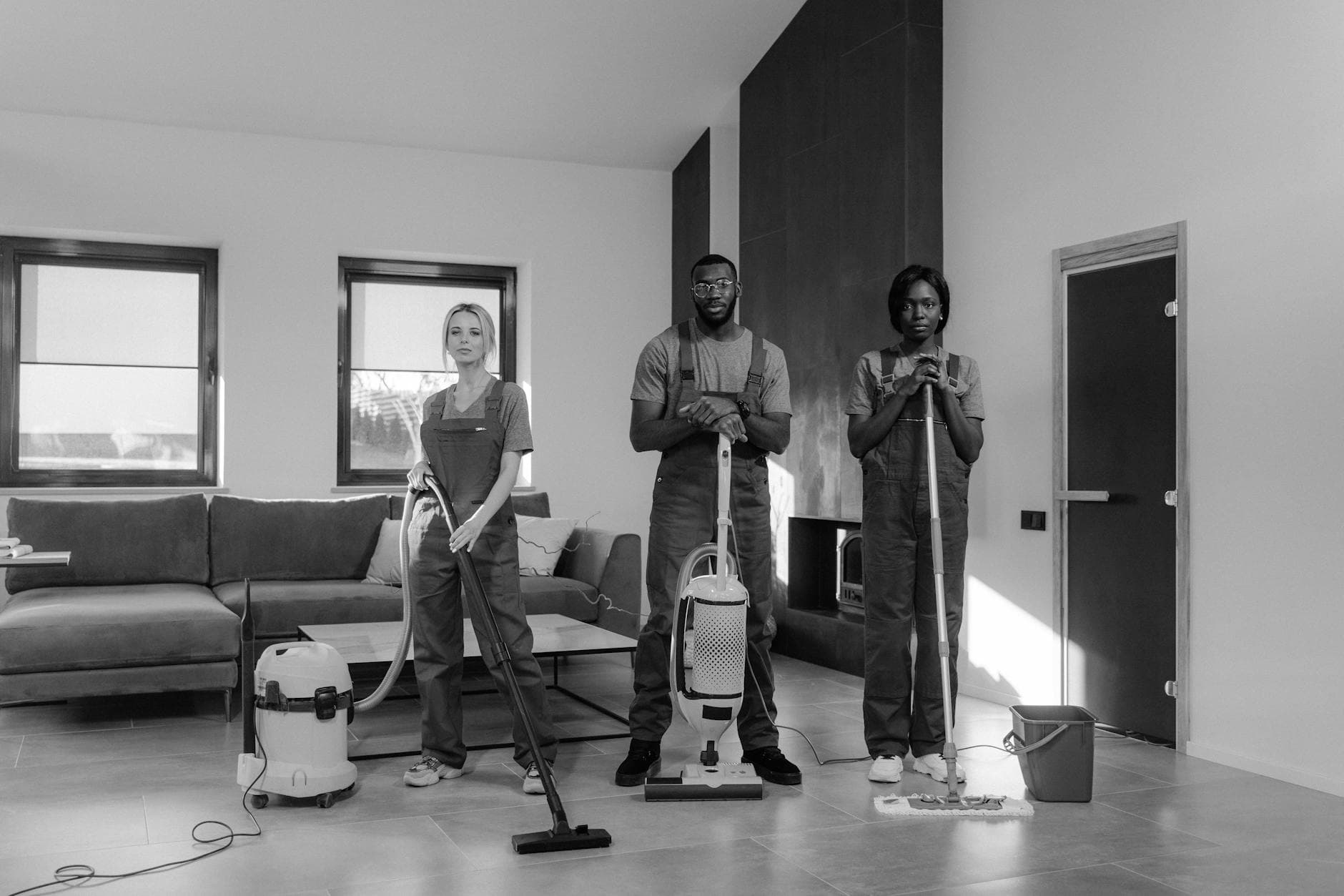 Three professional Your Business cleaners in uniform with equipment, ready for a job — Office Cleaning in SoHo, Manhattan